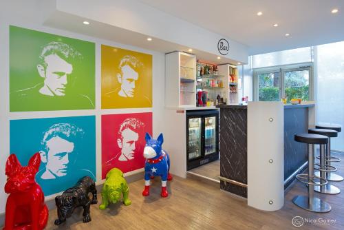 a room with a bar and some stuffed animals at ibis Styles Cannes Le Cannet in Cannes