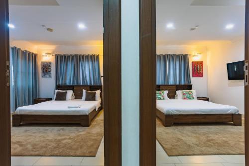 Ένα ή περισσότερα κρεβάτια σε δωμάτιο στο The Avery Apartments, Dzorwulu