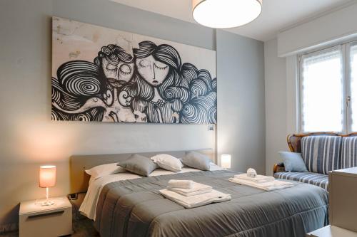 Ένα ή περισσότερα κρεβάτια σε δωμάτιο στο H11 [Mare Celeste] Centro - Mare