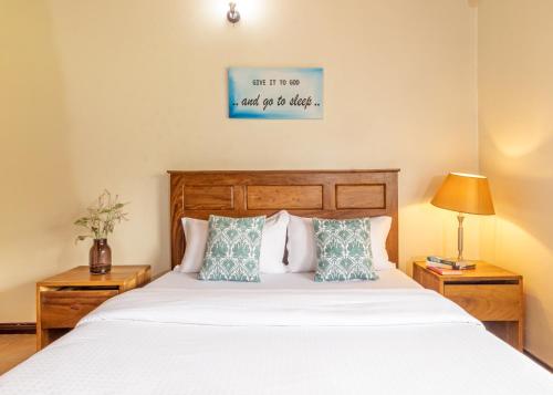 Un pat sau paturi într-o cameră la Nilescape Residence