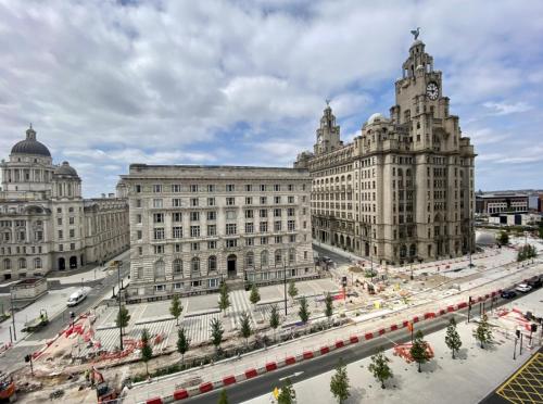 a large building with a street in front of it at Liverpool Waterfront Apartment in Liverpool