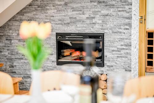 a brick fireplace with food inside of it at Magiczny Domek in Białka Tatrzanska