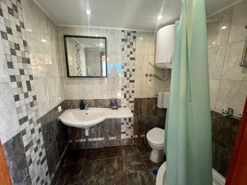 a bathroom with a sink and a toilet at Dominium Premium Location Suites in Dubrovnik