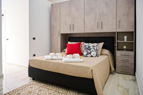 a bedroom with a bed with two towels on it at GG HOME in Saviano