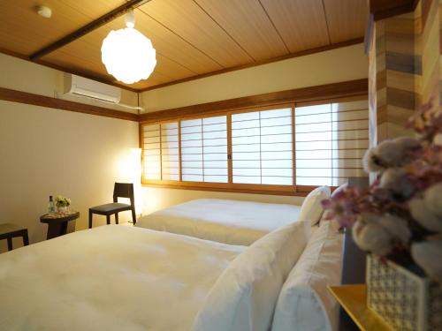 Postel nebo postele na pokoji v ubytování Hotel New Gaea Iizuka