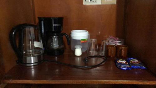 a counter with a coffee maker and other items on it at ERY total confort Pasto apto in Pasto