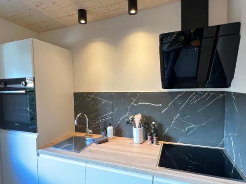 Mallnbach Apartmentsにあるキッチンまたは簡易キッチン