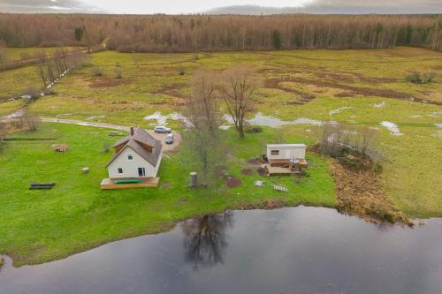an aerial view of a house on an island in the water at Tammearu villa in Kõpu