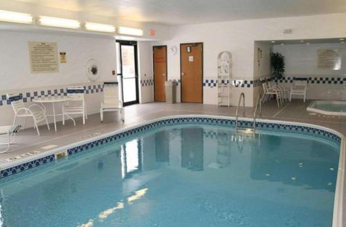 a large swimming pool in the middle of a building at Hampton Inn Chicago-Tinley Park in Tinley Park