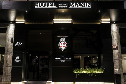 ホテル マニンに飾ってある許可証、賞状、看板またはその他の書類