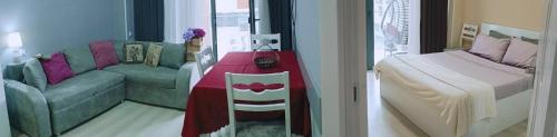 a living room with a couch and a table at Vake Residence close to Park Mziuri in Tbilisi City