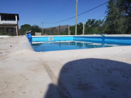 an empty swimming pool with blue paint on it at Mecohue in Villa Giardino