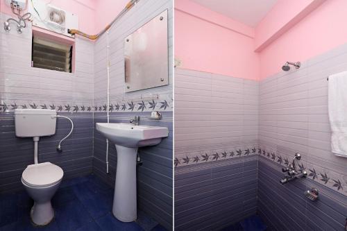 a bathroom with a sink and a toilet at Super Hotel O Sai Swastik in Bhubaneshwar