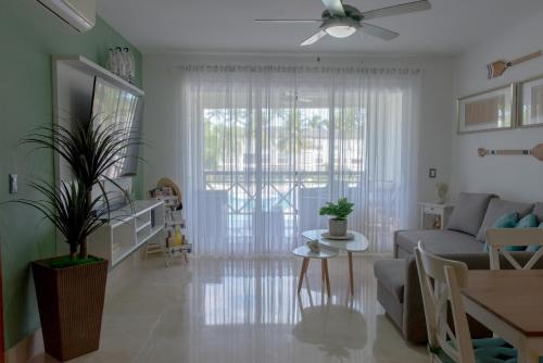 a living room with a couch and a table at Riviera Azul Playa Dorada in San Felipe de Puerto Plata