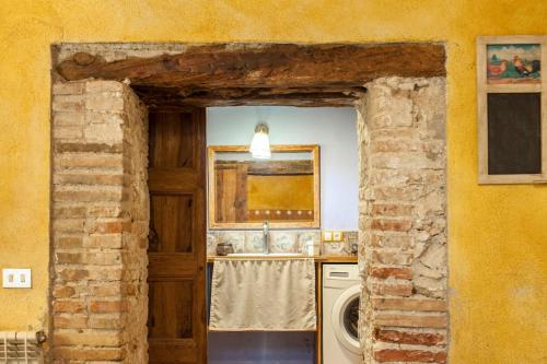 a kitchen with a sink and a washing machine at Catalunya Casas Rustic Vibes Villa with private pool 12km to beach in Vilafranca del Penedès
