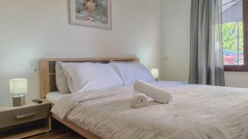 a bedroom with a bed with a pillow on it at Room Fiore in Novigrad Istria