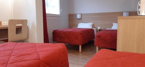 Cama o camas de una habitación en Premiere Classe Reims Nord - Bétheny