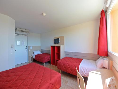 Cama o camas de una habitación en Premiere Classe Reims Nord - Bétheny