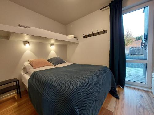 Ένα ή περισσότερα κρεβάτια σε δωμάτιο στο Giljagisting