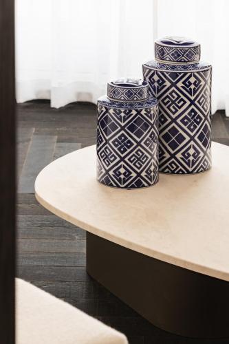 two blue and white vases sitting on a table at De Lindenhoeve Boutique Hotel in Sluis