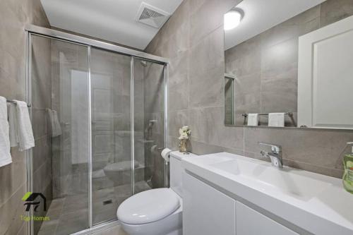 a bathroom with a shower and a toilet and a sink at Entire apartment in Hornsby in Hornsby