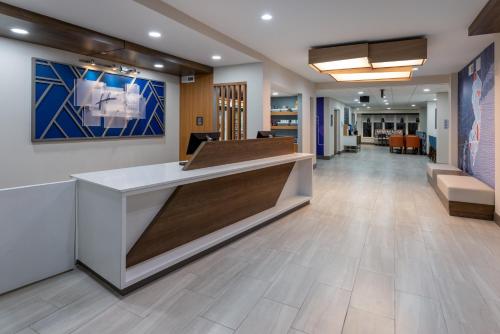 a lobby of a hospital with a reception desk at Holiday Inn Express Hotel & Suites Vineland Millville by IHG in Vineland