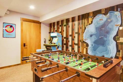 a room with a foosball table at Luna Cabin - 5BR Hot Tub A/C Game Room EV Charger in Tahoe Vista
