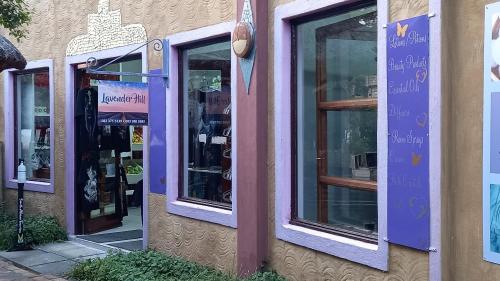 a row of windows on the side of a store at Misty peaks Cloudlands in Bergview