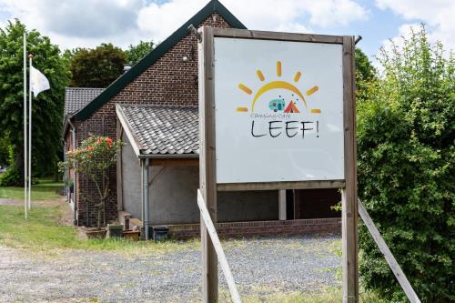 a sign in front of a building with a welcome sign at Camping Leef! in Melderslo