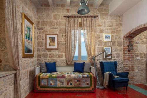 a bedroom with a bed and a window at Luxury seafront Villa Lighthouse Ligero on Host island - Vis island in Vis