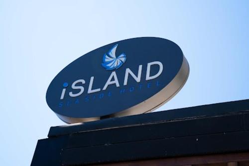a blue and white sign on top of a building at Island Sea Side Hotel - Adults Only in Rhodes Town