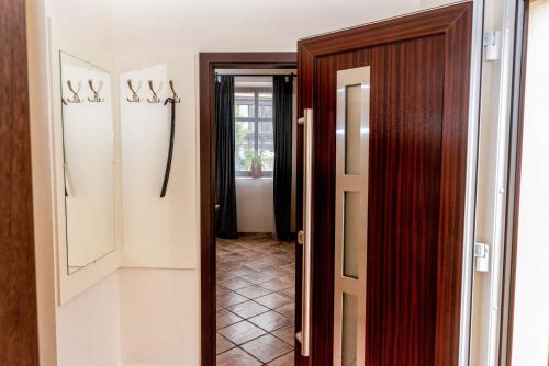 a door leading to a hallway with a hallway at Eco-Stúdió in Mosonmagyaróvár