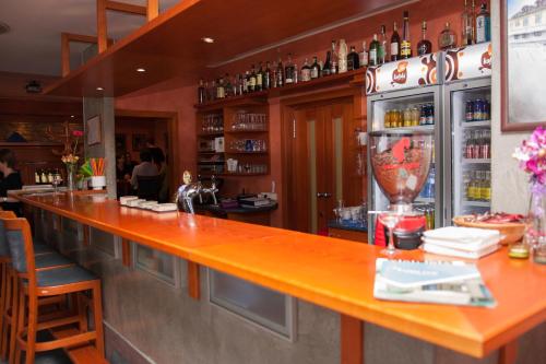 a bar with a long counter in a restaurant at Hotel Rottal in Otrokovice