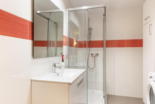 a bathroom with a sink and a shower at Antic 201 in S'Illot