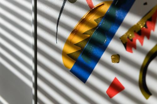a blue and gold medal hanging on a wall at Asher Suite by Koya Homes - 2-Bedroom Home, Downtown Barry, Free Parking in Barry
