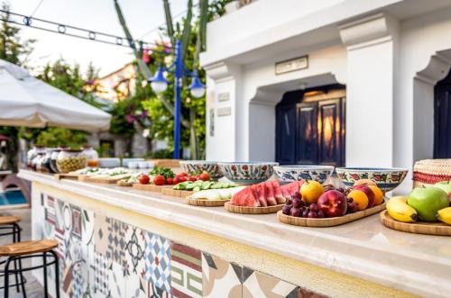 a buffet line with bowls of fruits and vegetables at Marphe Hotel in Datca