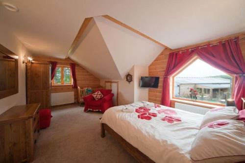 a bedroom with a bed and a window at Beech Tree Eco Lodge in Brecon