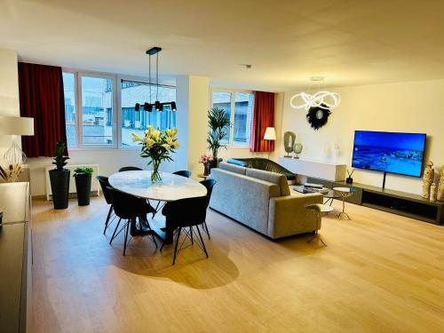 a living room with a table and a couch at Urbanstay Suites Grand Place Luxury Apartment in Brussels
