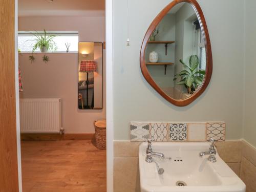 a bathroom with a sink and a mirror at Little Padley in Broadway