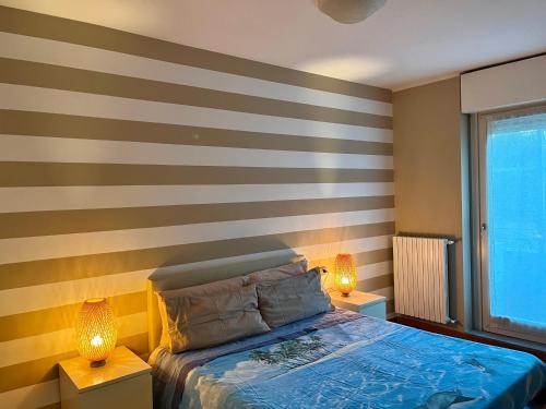 En eller flere senge i et værelse på Bergamo Bilocale Nuovo in centro 4 posti Letto