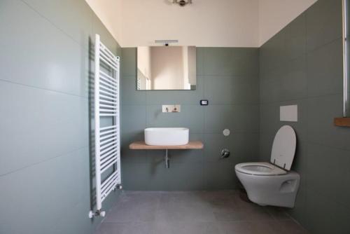 a bathroom with a toilet and a sink at Depandace Lavanda in Castignano