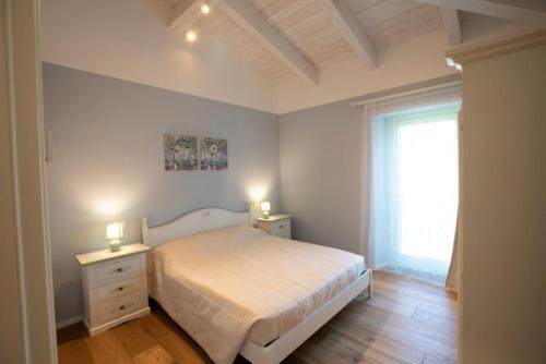 Кровать или кровати в номере Appartamento Ulivo