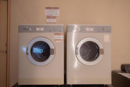 two washing machines are sitting next to each other at Kenting Southern Dream Resort in Kenting