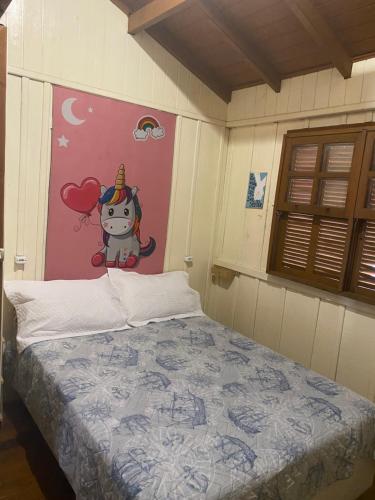 מיטה או מיטות בחדר ב-CASA DE PRAIA VILA NOVA IMBITUBA SC