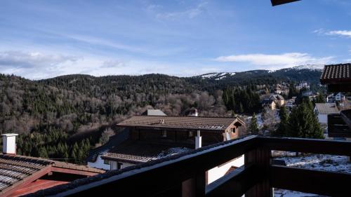 a view from the balcony of a house in the mountains at Aparthotel Vila San in Kopaonik