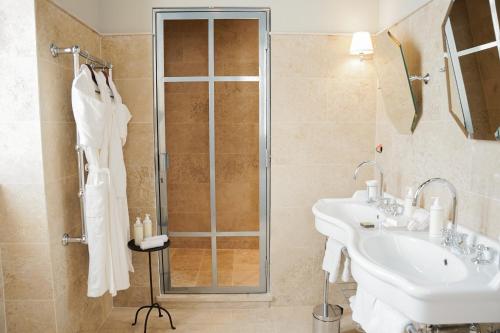 a bathroom with a sink and a shower at Château Sainte Sabine in Sainte-Sabine