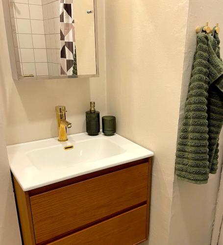 a bathroom with a sink and a mirror at Michael's in Copenhagen