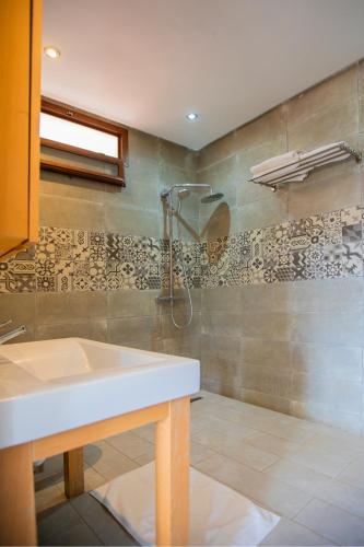 a bathroom with a sink and a shower at Dar Zayane in Khenifra
