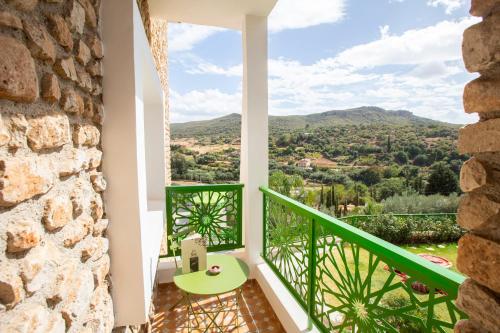 a room with a green balcony with a view at Dar Zayane in Khenifra