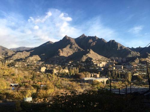 a view of a city with mountains in the background at HOUSE ON THE ROCK in Meghri